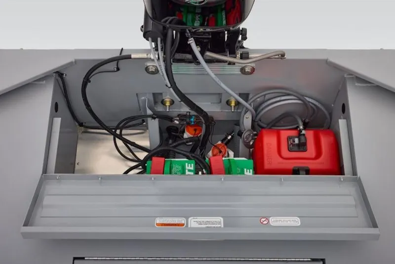 Slide: The Image of 2026 Tracker Bass Tracker Classic CC boat engine compartment with wiring and fuel tank. - 12