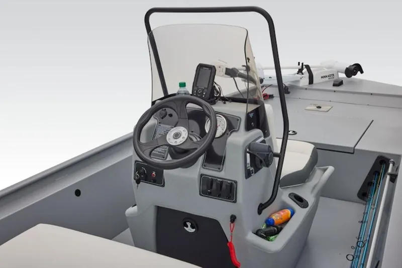 Slide: The Image of 2026 Tracker Bass Tracker Classic CC boat console with steering wheel and controls. - 3