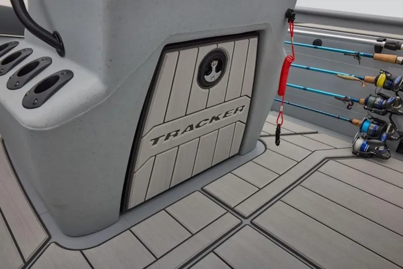 Slide: The Image of 2026 Tracker Bass Tracker Classic CC boat interior with rod holders and storage compartment. - 6