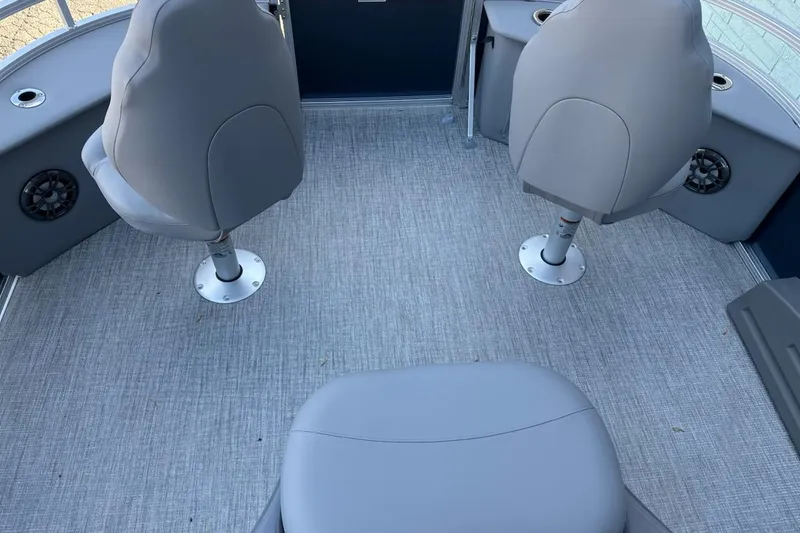 Slide: The Image of 2026 Avalon Venture 85 Center Fish 2385 boat interior with gray seating and carpet. - 11