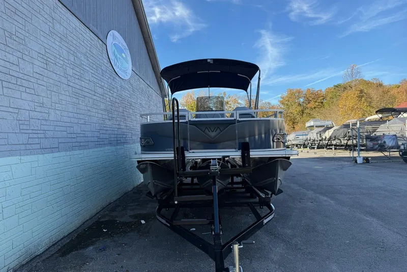 Slide: The Image of 2026 Avalon Venture 85 Center Fish 2385 pontoon boat on trailer, parked outside. - 3