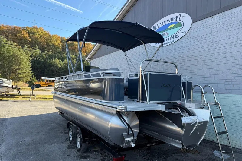 Slide: The Image of 2026 Avalon Venture 85 Center Fish 2385 pontoon boat with canopy, parked outdoors. - 4