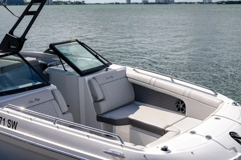 Slide: The Image of 2021 Yamaha Boats AR250, luxurious seating, open water view, modern design. - 17