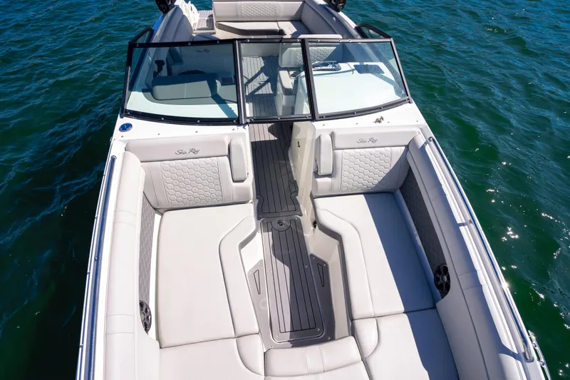 Slide: The Image of 2021 Yamaha Boats AR250 with spacious seating on calm water. - 21
