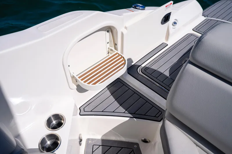 Slide: The Image of 2021 Yamaha AR250 boat interior with sleek seating and modern design features. - 26