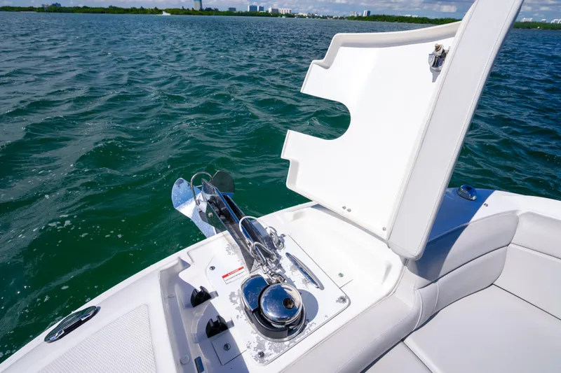 Slide: The Image of 2021 Yamaha AR250 boat anchor compartment open on calm water. - 28