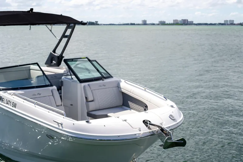 Slide: The Image of A sleek 2021 Yamaha Boats AR250 on calm waters, featuring modern design and comfort. - 4