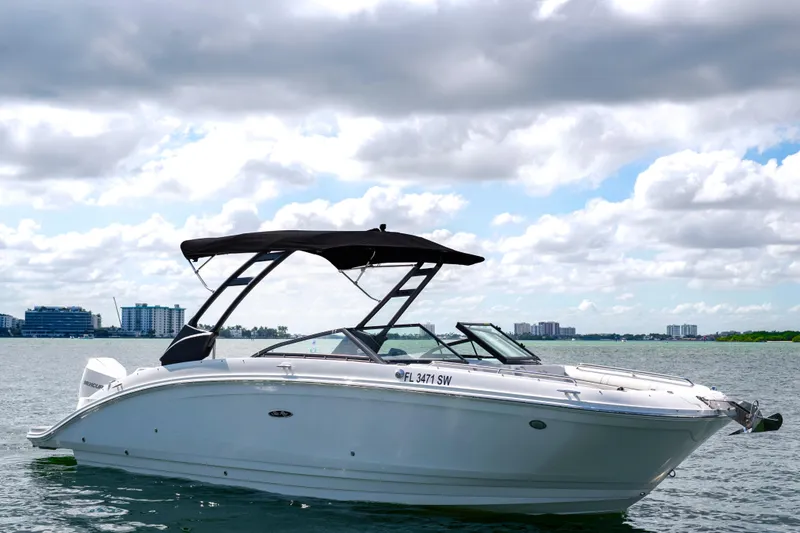 Slide: The Image of 2021 Yamaha Boats AR250 on water under cloudy sky. - 5