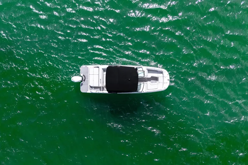 Slide: The Image of Aerial view of 2021 Yamaha AR250 boat on vibrant green water. - 8