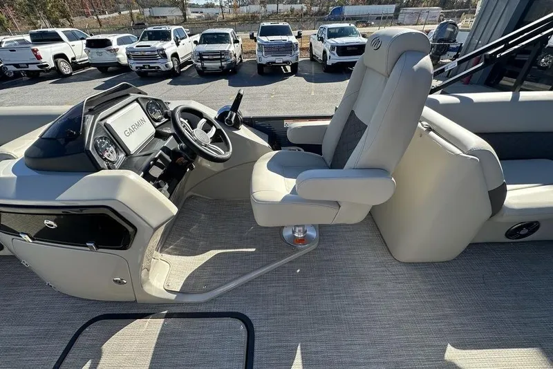 Slide: The Image of Interior of 2026 Manitou 23 Encore RF boat with Garmin navigation system. - 16