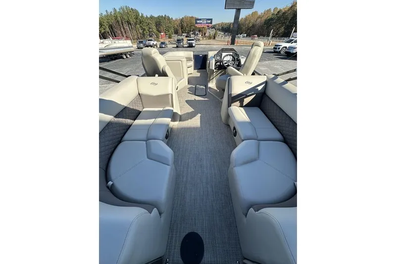 Slide: The Image of 2026 Manitou 23 Encore RF pontoon boat interior with luxurious seating and modern design. - 8