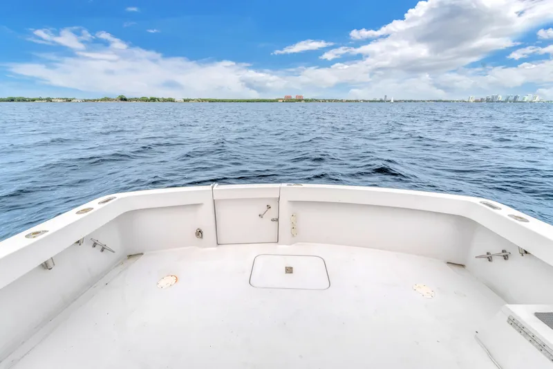 Slide: The Image of 1978 Hatteras 42 Convertible boat deck with ocean view under blue sky. - 29