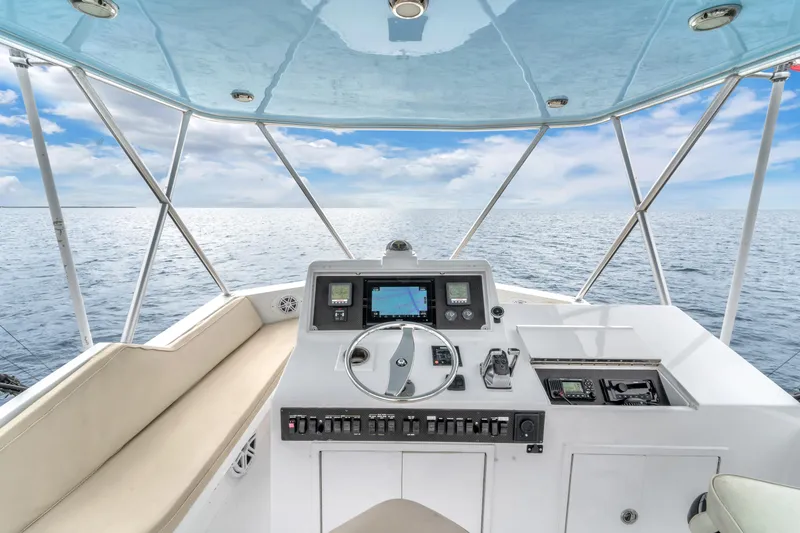 Slide: The Image of Cockpit view of 1978 Hatteras 42 Convertible yacht on open sea. - 32
