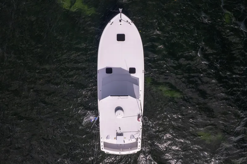 Slide: The Image of Aerial view of 1978 Hatteras 42 Convertible boat on dark water. - 35