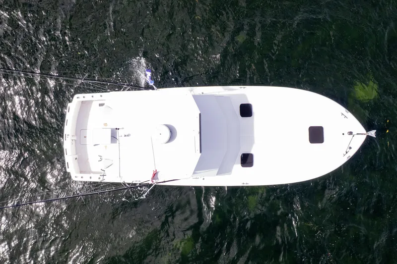 Slide: The Image of Aerial view of 1978 Hatteras 42 Convertible boat on water. - 36