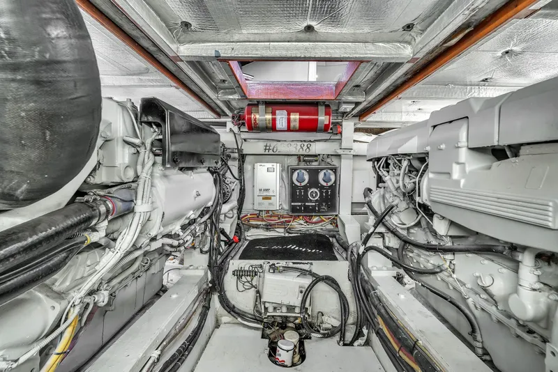 Slide: The Image of Engine room of 1978 Hatteras 42 Convertible yacht, showcasing mechanical components and wiring. - 40
