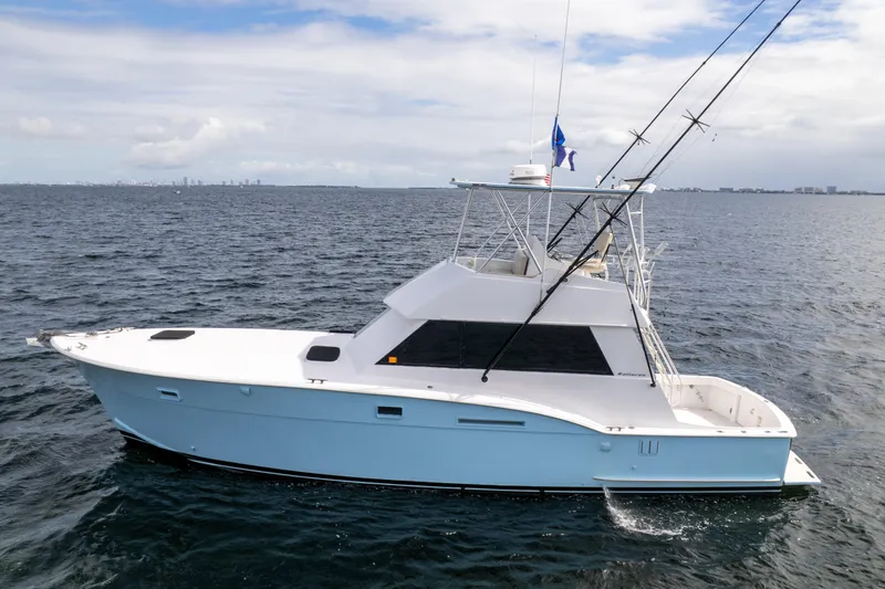 Slide: The Image of 1978 Hatteras 42 Convertible yacht on open water, side view. - 6