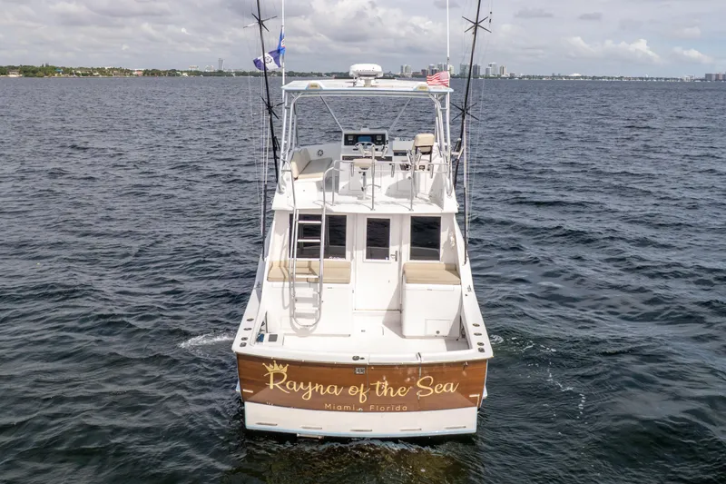 Slide: The Image of 1978 Hatteras 42 Convertible boat on water, named "Rayna of the Sea," Miami, Florida. - 9