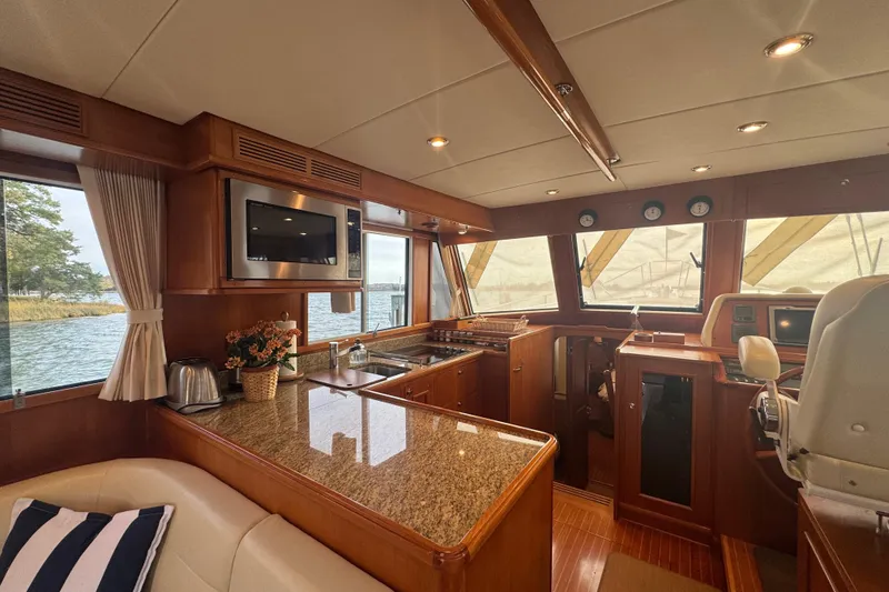 Slide: The Image of Luxurious 2011 Grand Banks 47 Heritage EU yacht interior with modern kitchen and helm. - 14
