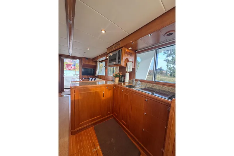 Slide: The Image of Interior of 2011 Grand Banks 47 Heritage EU yacht with wooden cabinetry and modern amenities. - 18