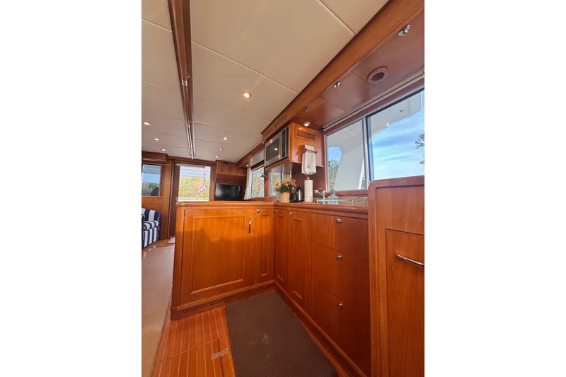 Slide: The Image of Luxurious wooden interior of 2011 Grand Banks 47 Heritage EU yacht kitchen. - 21