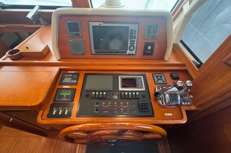 Slide: The Image of Control panel of 2011 Grand Banks 47 Heritage EU yacht, featuring navigation and control systems. - 23
