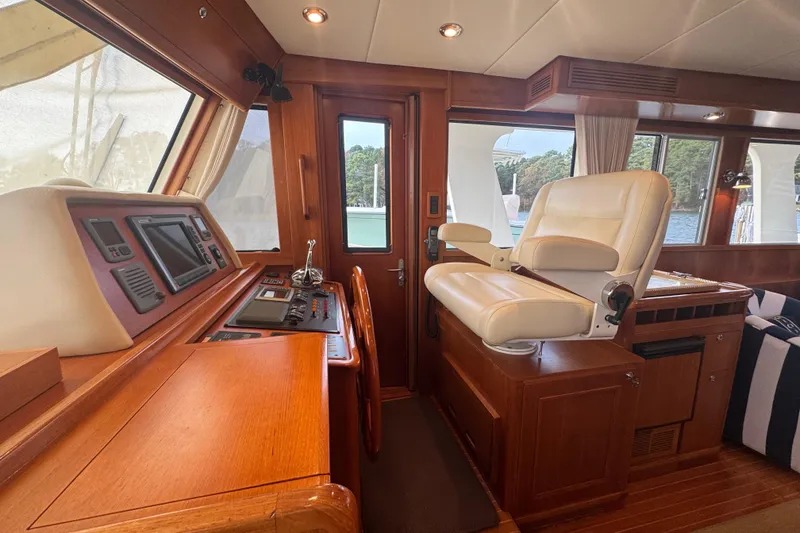 Slide: The Image of Luxurious helm station of 2011 Grand Banks 47 Heritage EU yacht with plush seating. - 24