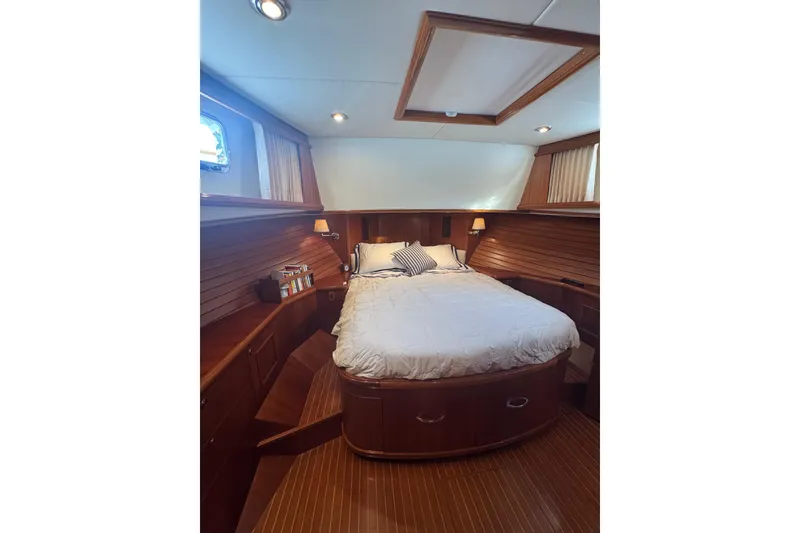 Slide: The Image of Luxurious cabin interior of 2011 Grand Banks 47 Heritage EU yacht with cozy bed and wooden finish. - 26