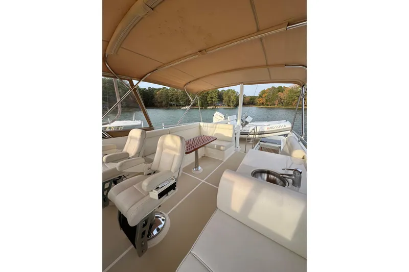 Slide: The Image of Luxurious 2011 Grand Banks 47 Heritage EU yacht interior with seating and scenic water view. - 31
