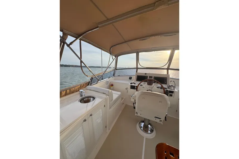 Slide: The Image of 2011 Grand Banks 47 Heritage EU yacht helm with ocean view and elegant interior. - 32