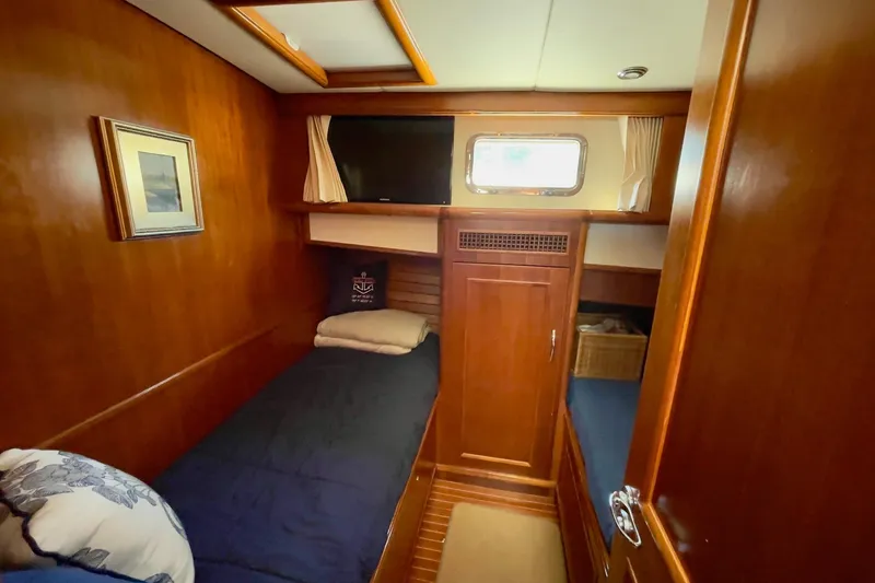 Slide: The Image of Cozy cabin interior of 2011 Grand Banks 47 Heritage EU yacht with wooden finish. - 4