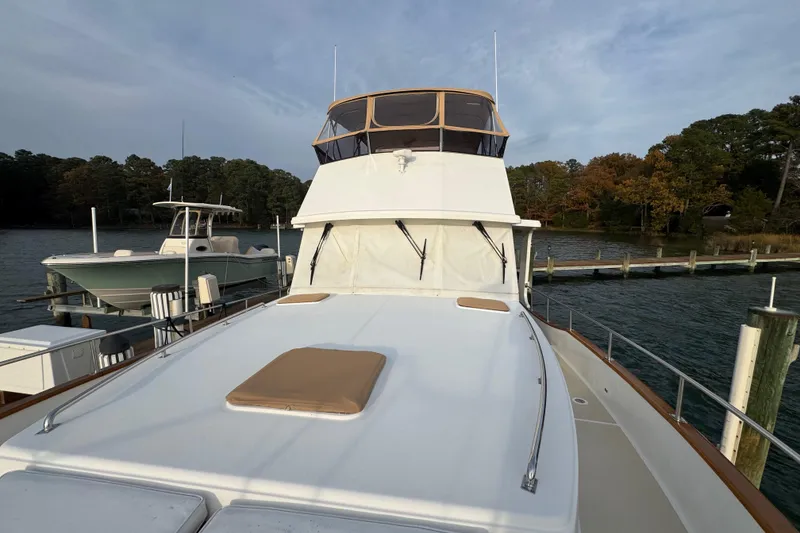 Slide: The Image of 2011 Grand Banks 47 Heritage EU yacht docked by a scenic waterfront. - 41