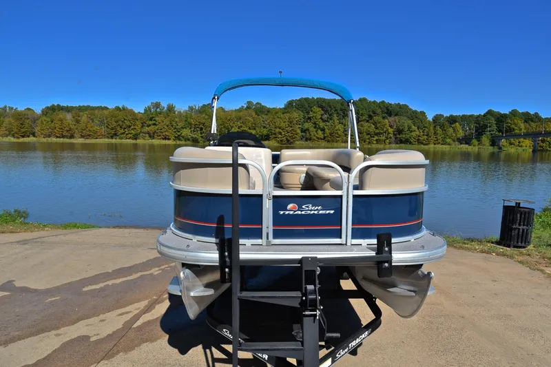 Slide: The Image of 2019 Sun Tracker Party Barge 18 DLX pontoon boat by a scenic lake. - 17