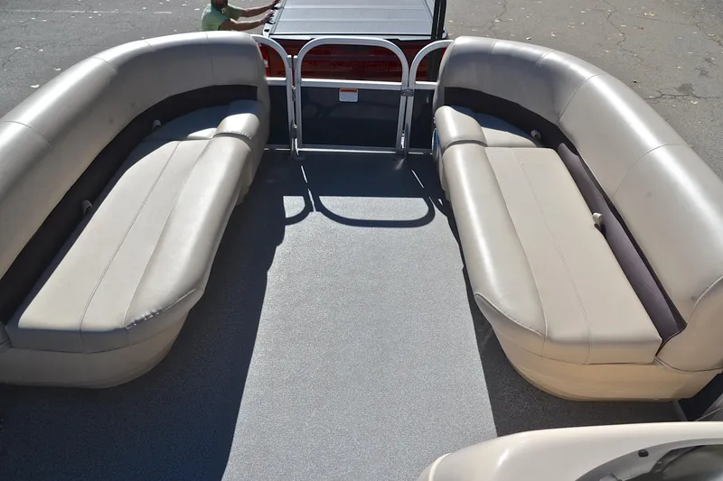 Slide: The Image of 2019 Sun Tracker Party Barge 18 DLX interior with spacious seating and sleek design. - 21