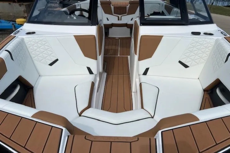 Slide: The Image of 2026 Nautique Super Air Nautique GS22 interior with white and brown seating. - 4