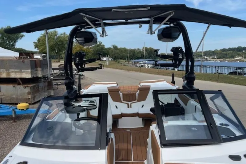 Slide: The Image of 2026 Nautique Super Air Nautique GS22 boat with open deck and sleek design. - 5