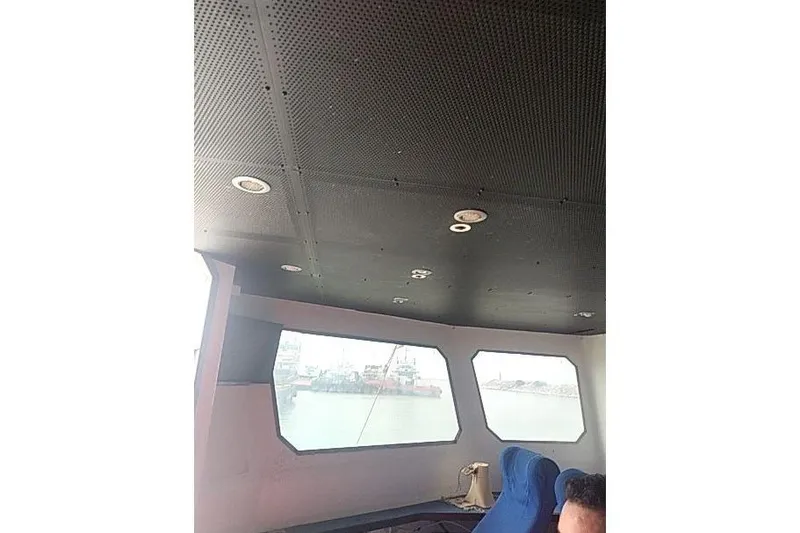 Slide: The Image of Interior of 2016 Mützelfeldtwerft Offshore Fast Crew Taxi Catamaran with blue seating. - 25