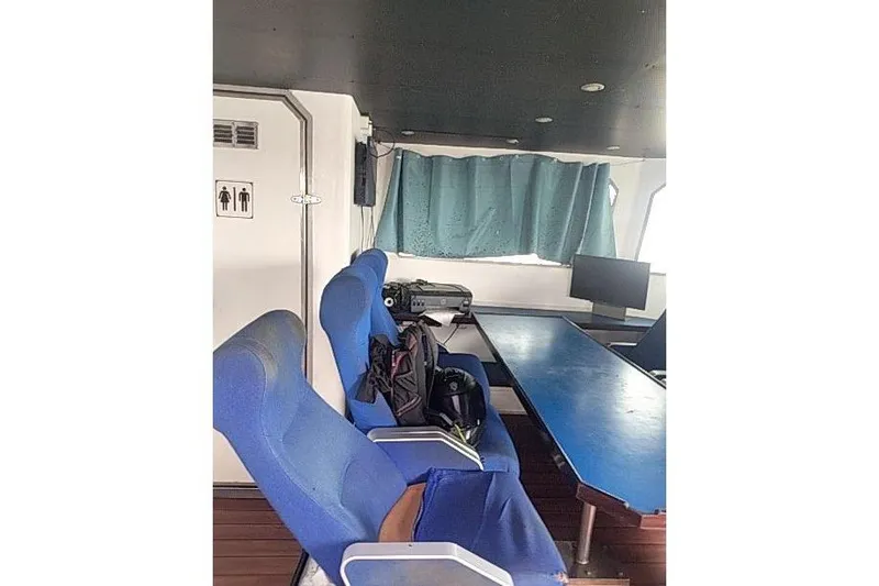 Slide: The Image of Interior of 2016 Mützelfeldtwerft Offshore Fast Crew Taxi Catamaran with blue seating. - 27