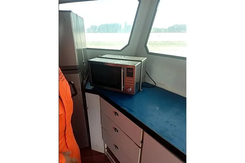 Slide: The Image of Microwave on counter inside 2016 Mützelfeldtwerft Offshore Fast Crew Taxi Catamaran. - 30