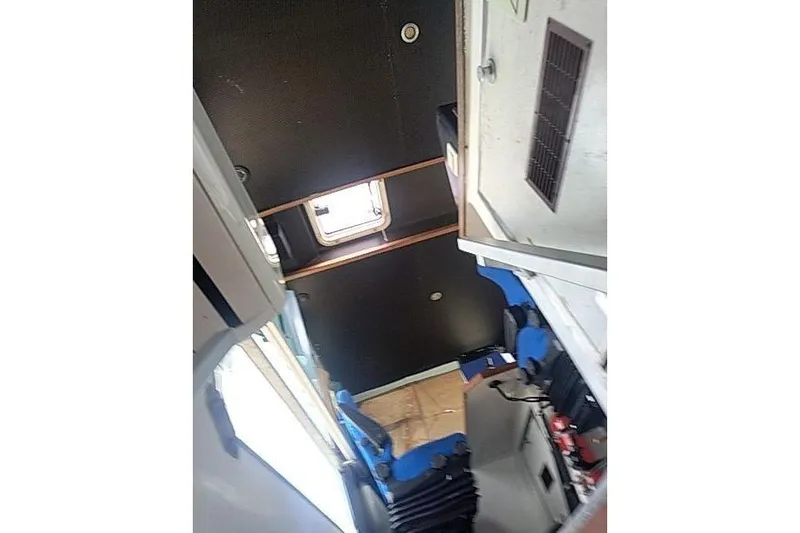 Slide: The Image of Interior of a 2016 Mützelfeldtwerft Offshore Fast Crew Taxi Catamaran, featuring seating and hatch. - 38