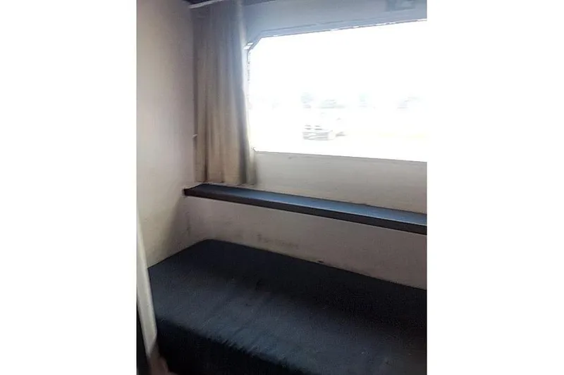 Slide: The Image of Interior cabin of 2016 Mützelfeldtwerft Offshore Fast Crew Taxi Catamaran with bed and window. - 39