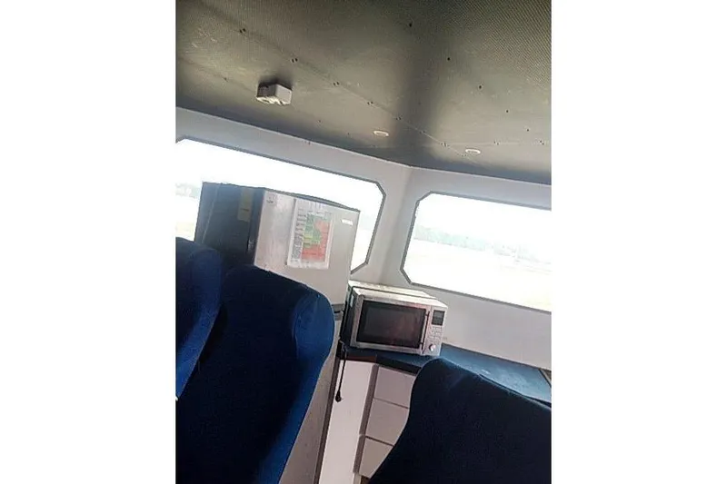 Slide: The Image of Interior of 2016 Mützelfeldtwerft Offshore Fast Crew Taxi Catamaran with microwave and seating. - 41