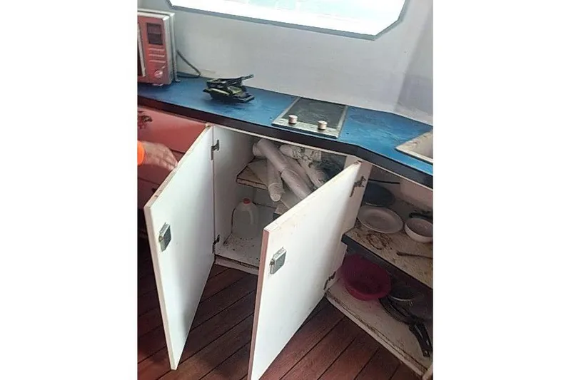 Slide: The Image of Interior of 2016 Mützelfeldtwerft Offshore Fast Crew Taxi Catamaran kitchen area with open cabinets. - 42
