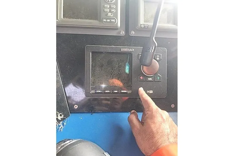 Slide: The Image of Control panel of 2016 Mützelfeldtwerft Offshore Fast Crew Taxi Catamaran with hand operating Simrad display. - 44