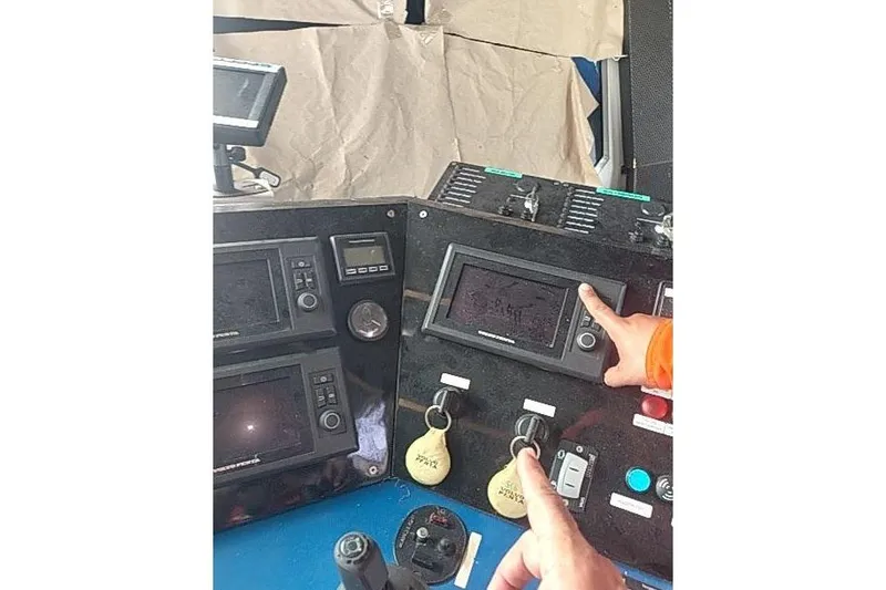 Slide: The Image of Control panel of a 2016 Mützelfeldtwerft Offshore Fast Crew Taxi Catamaran with navigation screens. - 47