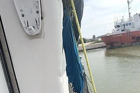 Slide: The Image of Offshore Fast Crew Taxi Catamaran by Mützelfeldtwerft, 2016, docked near a red vessel. - 9