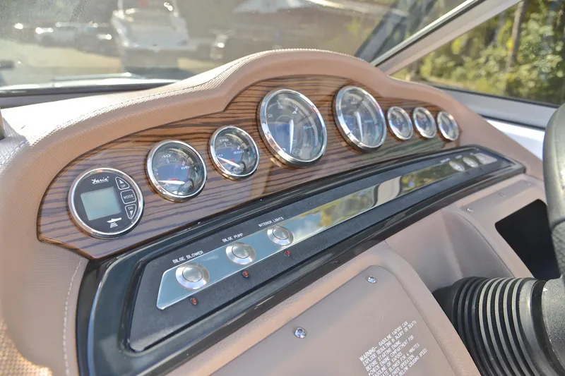 Slide: The Image of 2007 Cobalt 232 dashboard with wood accents and multiple gauges. - 24