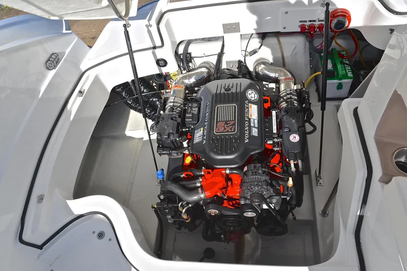 Slide: The Image of Engine compartment of a 2007 Cobalt 232 boat featuring a Volvo Penta 5.7 GXI engine. - 26