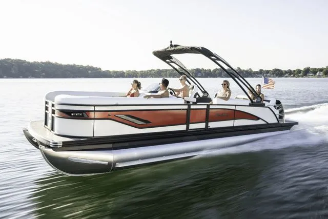 The Image of 2026 Barletta Corsa 23UA pontoon boat cruising on a lake with passengers enjoying the ride. - 0