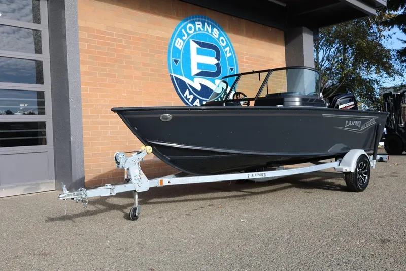 Slide: The Image of 2026 Lund 1675 Adventure Sport boat on trailer outside Bjornson Marine. - 14